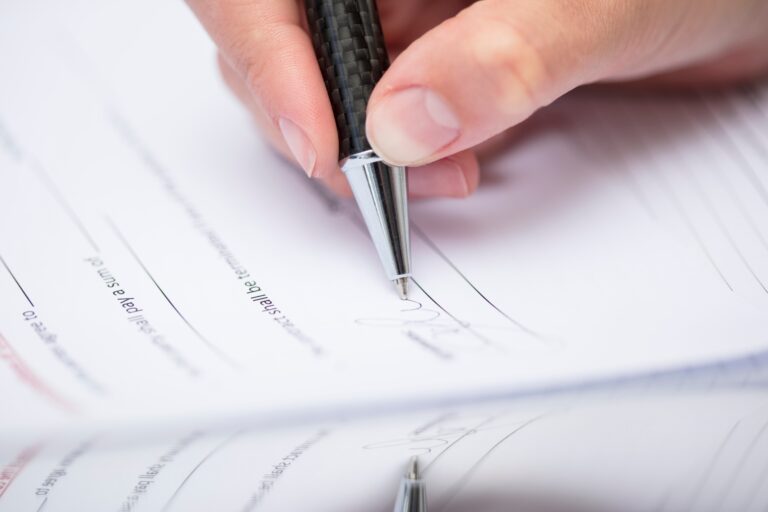 Woman signing documents